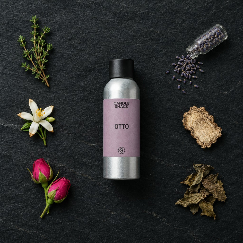 Otto fragrance oil - Candle Shack aluminium bottle with dried botanicals on a dark slate background