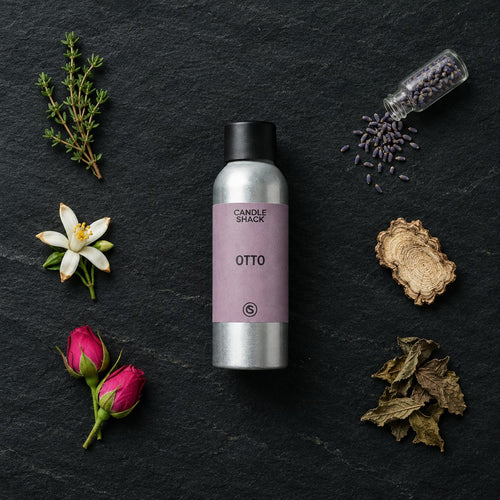 Otto fragrance oil - Candle Shack aluminium bottle with dried botanicals on a dark slate background