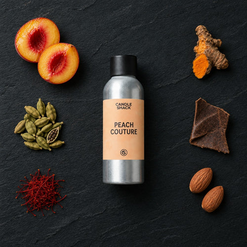 Peach Couture fragrance oil - Candle Shack aluminium bottle with dried botanicals on a dark slate background
