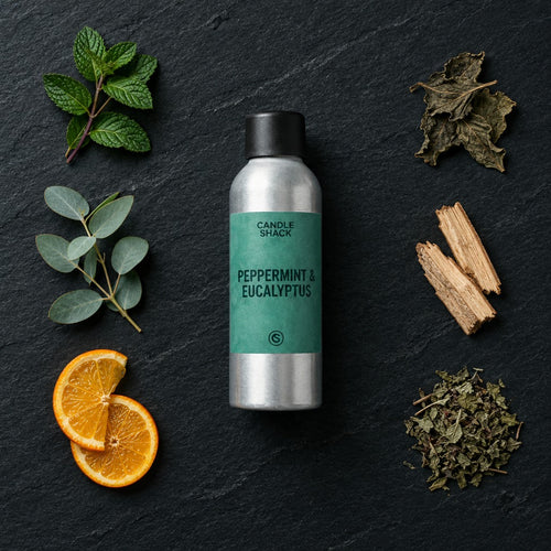 Peppermint and Eucalyptus fragrance oil - Candle Shack aluminium bottle with dried botanicals on a dark slate background
