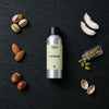 Pistache fragrance oil - Candle Shack aluminium bottle with dried botanicals on a dark slate background