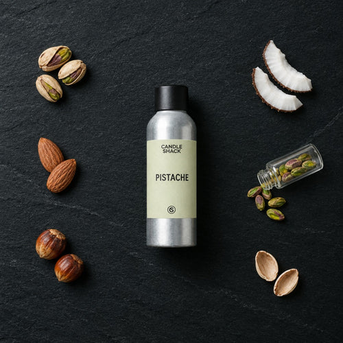 Pistache fragrance oil - Candle Shack aluminium bottle with dried botanicals on a dark slate background