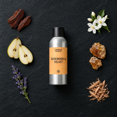 Rosewood and Velvet fragrance oil - Candle Shack aluminium bottle with dried botanicals on a dark slate background