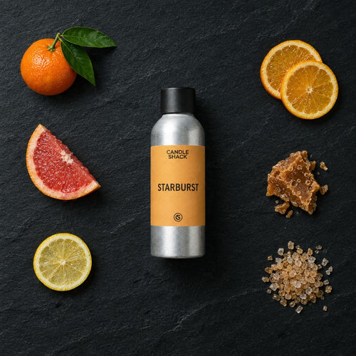 Starburst fragrance oil - Candle Shack aluminium bottle with dried botanicals on a dark slate background