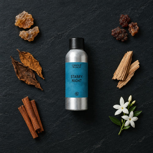 Starry Night fragrance oil - Candle Shack aluminium bottle with dried botanicals on a dark slate background