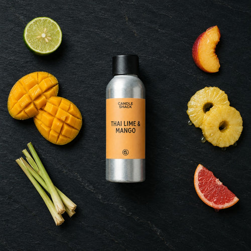 Thai Lime & Mango fragrance oil - Candle Shack aluminium bottle with dried botanicals on a dark slate background