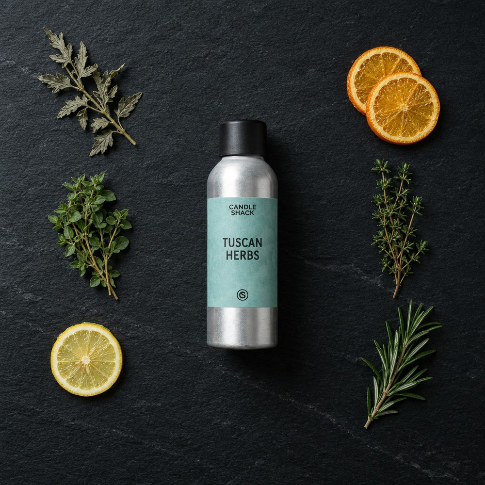 Tuscan Herbs fragrance oil - Candle Shack aluminium bottle with dried botanicals on a dark slate background