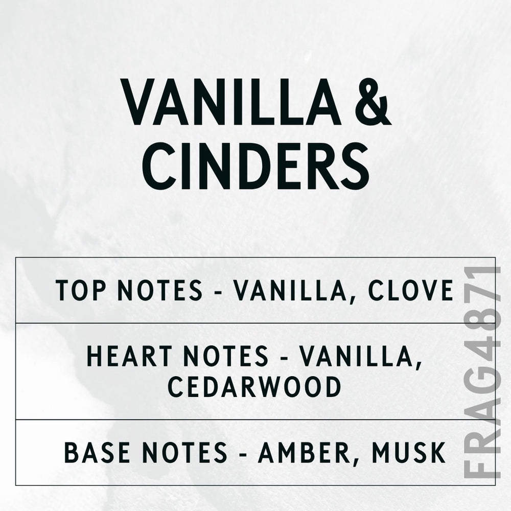 Vanilla & Cinders fragrance oil - Candle Shack aluminium bottle with dried botanicals on a dark slate background