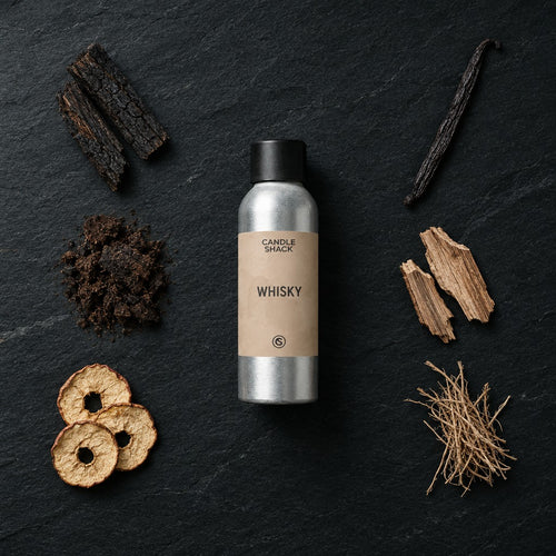 Whisky fragrance oil - Candle Shack aluminium bottle with dried botanicals on a dark slate background