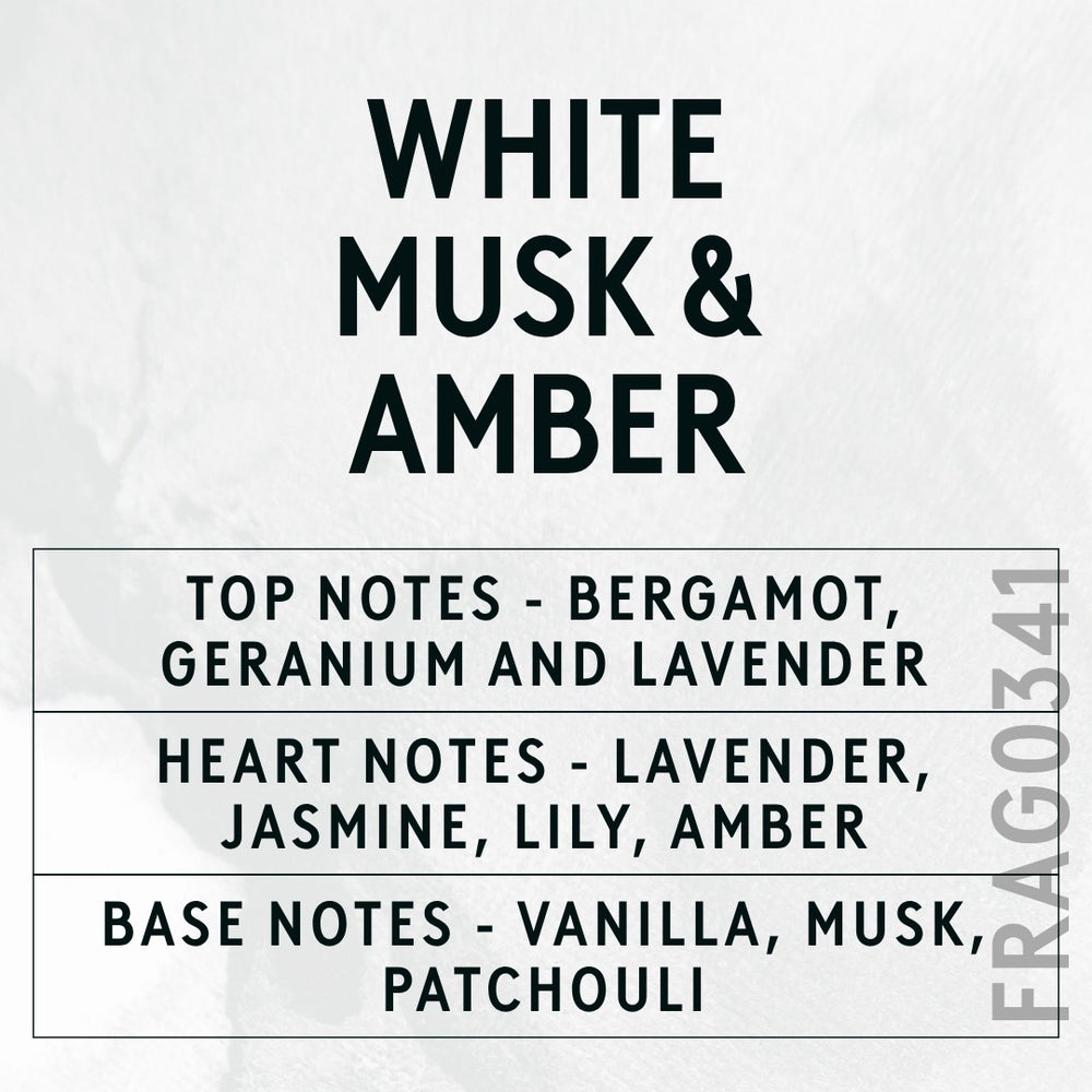 White Musk & Amber fragrance oil - Candle Shack aluminium bottle with dried botanicals on a dark slate background