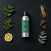 Wild Mint fragrance oil - Candle Shack aluminium bottle with dried botanicals on a dark slate background