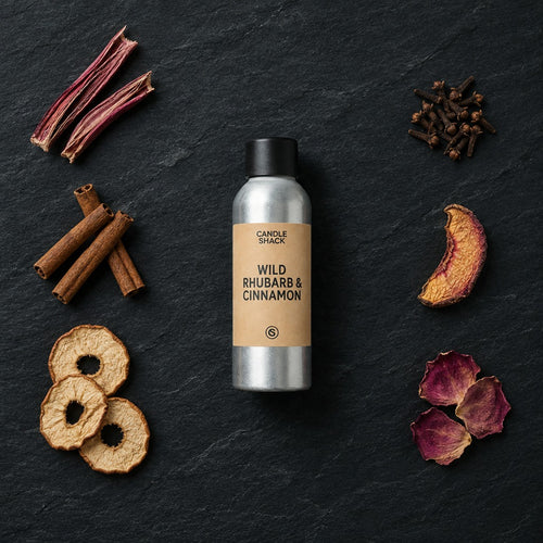 Wild Rhubarb & Cinnamon fragrance oil - Candle Shack aluminium bottle with dried botanicals on a dark slate background