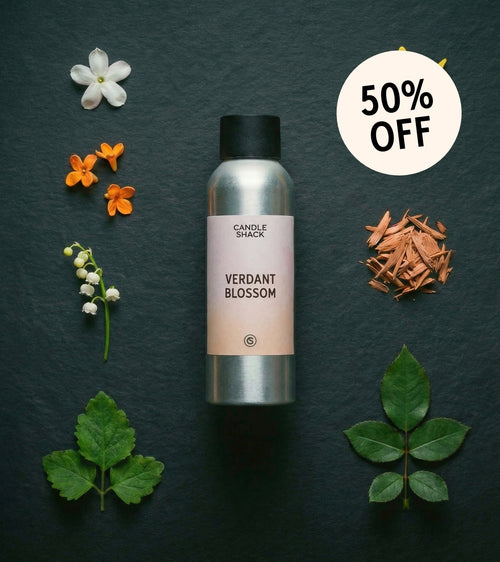 Candle Shack 'Verdant Blossom' fragrance oil with flowers and leaves on a dark background