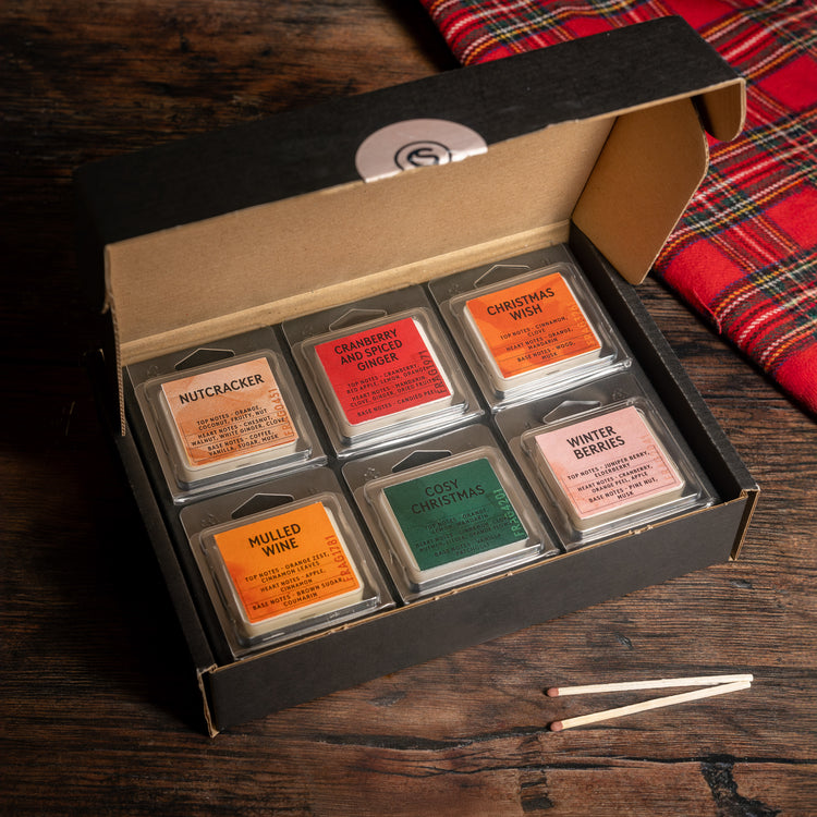 Christmas scent sample box on a wooden surface